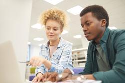 Young students at a laptop studying [Shutterstock].jpg